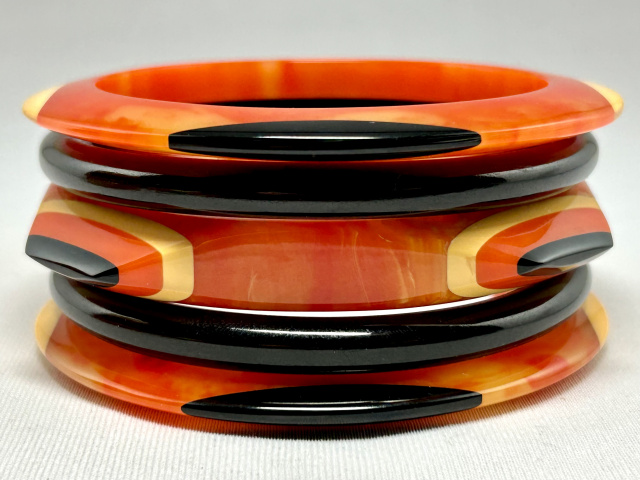 SZ20 Shultz 5 pc orange, black & cream bakelite bangle set